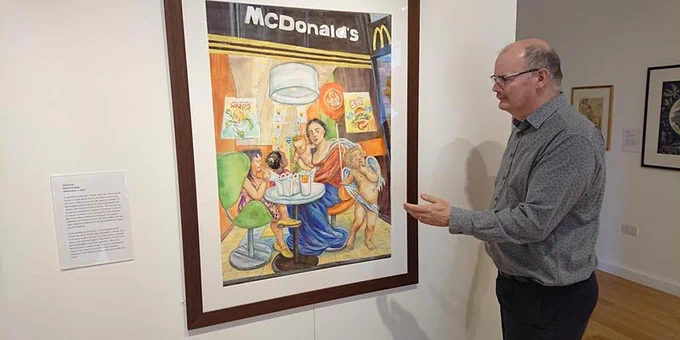Museum Director giving a tour, in front of Steph Bates' "Macdonna"