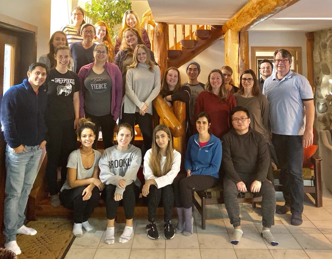 Kobor lab member and Dr. Kobor group photo. Everyone is smiling into the camera.
