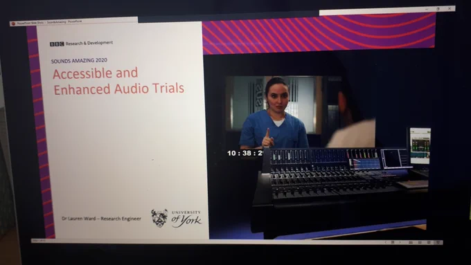 Photo of laptop screen with slide that says 'Accessible and Enhanced Audio Trials' - Dr Lauren Ward - Research Engineer - University of York - on the right is a photo of a mixing desk with the screen in the background showing a frame of Casualty