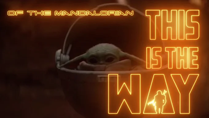 Baby Yoda, AKA the Child is adorable in his stroller ball in a desert setting with bright bold  illuminated laser script text surrounding him reading "Of the Mandalorian" "This is the Way"  This picture is a screenshot from The artist Get back VAL's new Lyric video "This is the Way" A song tributing the Disney Plus Series "The Mandalorian" in 80's rock style!  Season 2 begins on oct 30th. Excitement is building! A hyperlink is available that sends you to youtube to hear the song and/or watch the video while you read the lyrics! This is the way