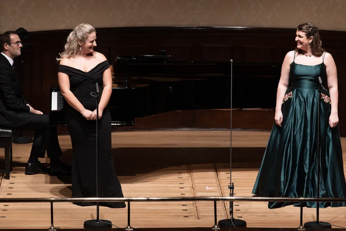 Christopher Glynn sits at the piano, with Samantha Quillish and Lauren Young on stage at the Wigmore Hall.