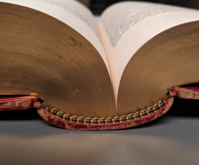 Images of a deep gutter, center-region, of a rare book from Stanford Libraries' collection.