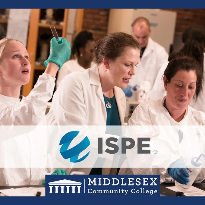 A professor watches over as two students work in a lab. ISPE. 