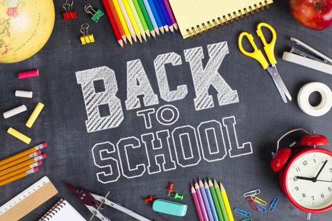 TEXT: back to school. school supplies surrounding text