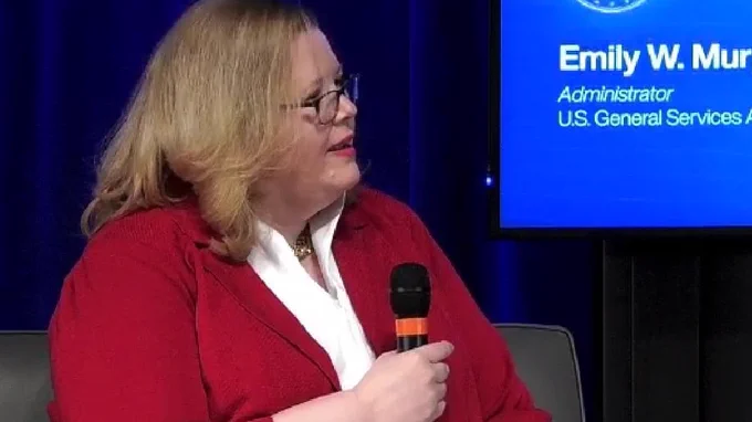 Close up of Administrator Murphy Speaking with microphone. 