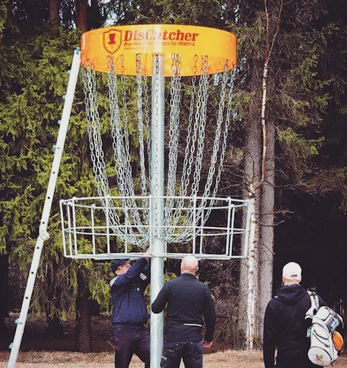 Super-tall disc golf basket in Finland