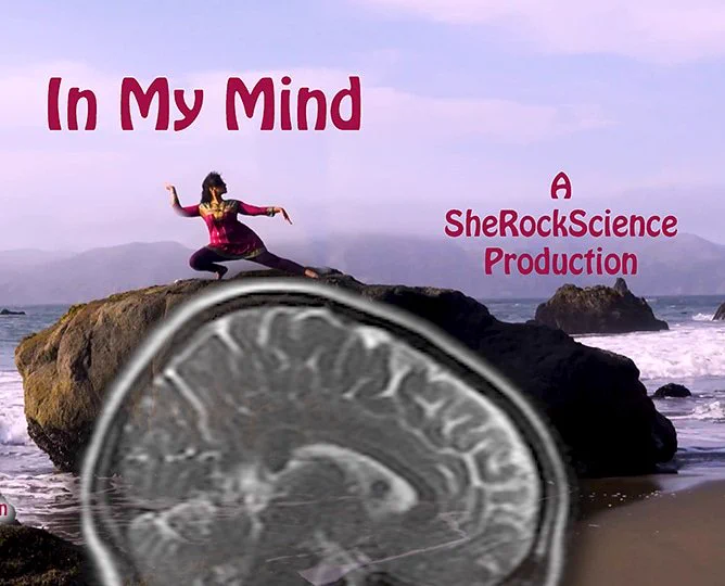 In My Mind. A woman in a traditional Indian dance position on top of a rock with a brain scan superimposed. A SheRockScience Production. This is a picture for a video link