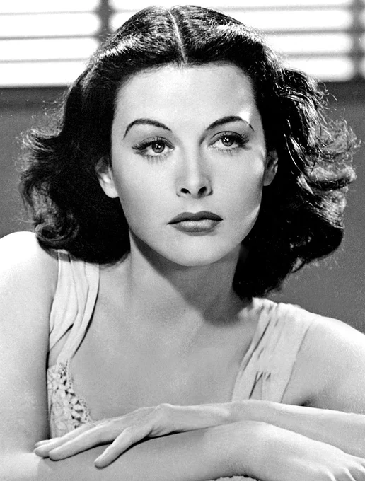 A black and white photo of actress and researcher Hedy Lamarr, from 1940. 
