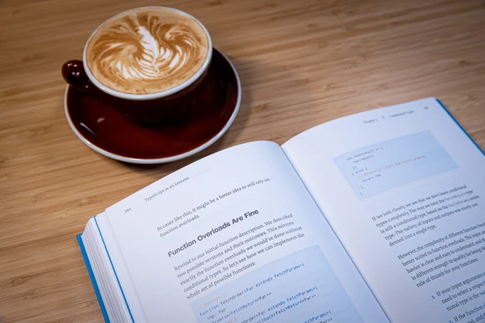 An inner look into the book, with syntax highlighting and… a coffee nearby ;)