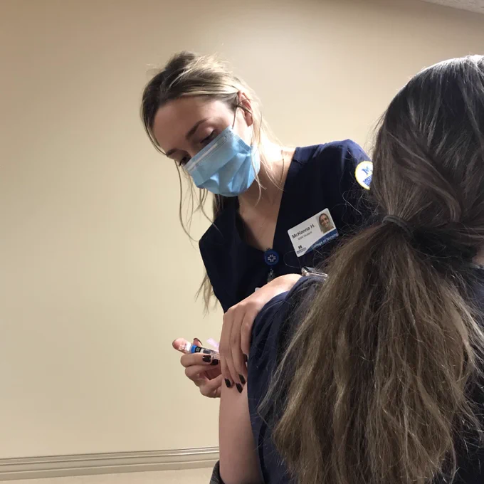 A bachelor’s nursing student from the Montana State University College of Nursing’s Billings campus administers a flu vaccination this fall to an employee at St. Vincent Healthcare in Billings.