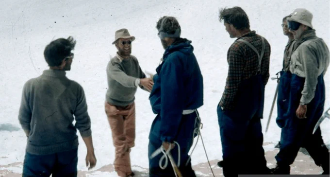 From the Nepali Times: "James Morris, on commission for the Times of London, congratulating Edmund Hillary as he arrives back at Advanced Base Camp from the summit of Everest 1953 Photo: Alf Gregory." 