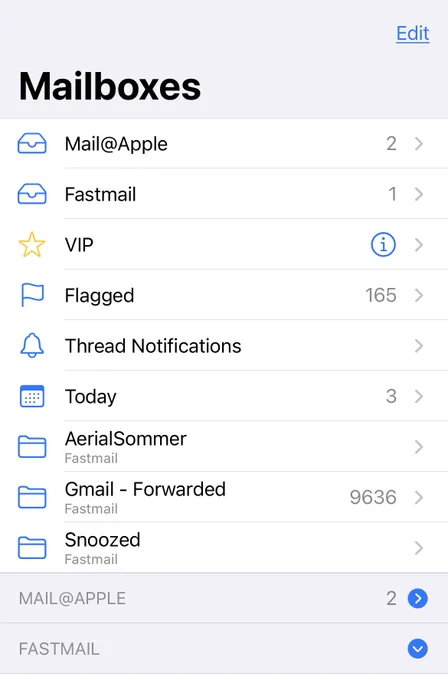 Screenshot of Mail app inbox screen. Key features of note: Edit button in top left is now underlined. Disclosure arrows that expand cells down are now blue circles with white chevrons in the middle.