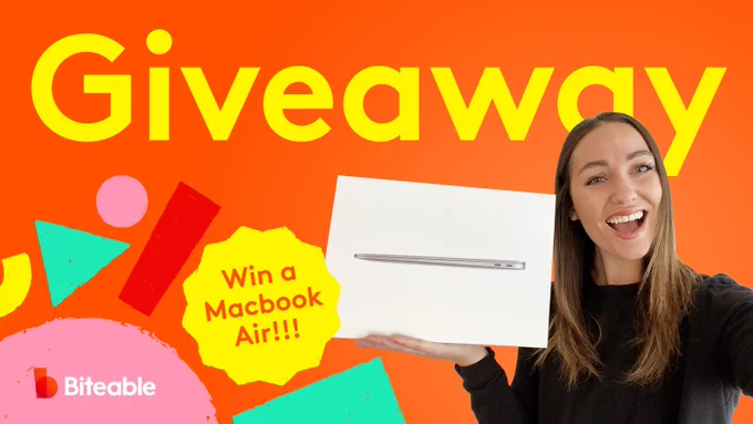 Our social media manager, Haily, poses with the Macbook Air that Biteable is giving away. 