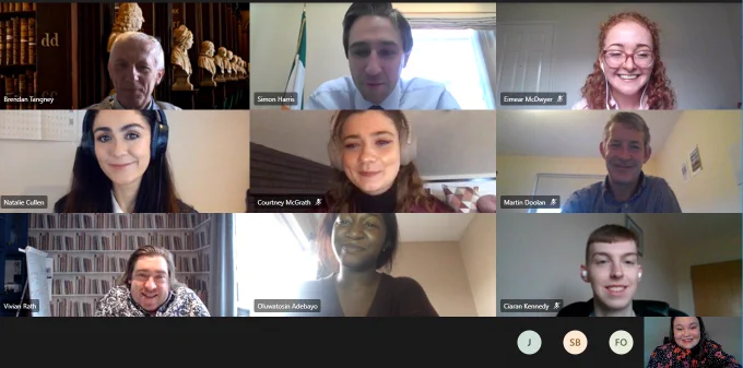 Online meeting screenshot of Minister Simon Harris, six Trinity students (three male and three female) and three Trinity staff members (one male and two female). Nine smiling faces. 