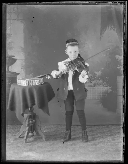 Young boy playing the violin, Glengarry County, between 1895 and 1910 (I0002501)