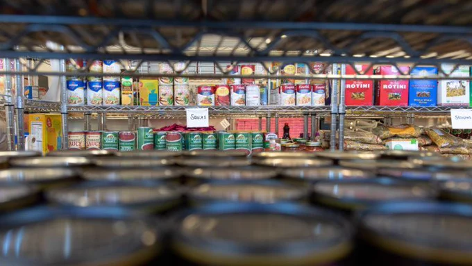 Food cans on a shelf 