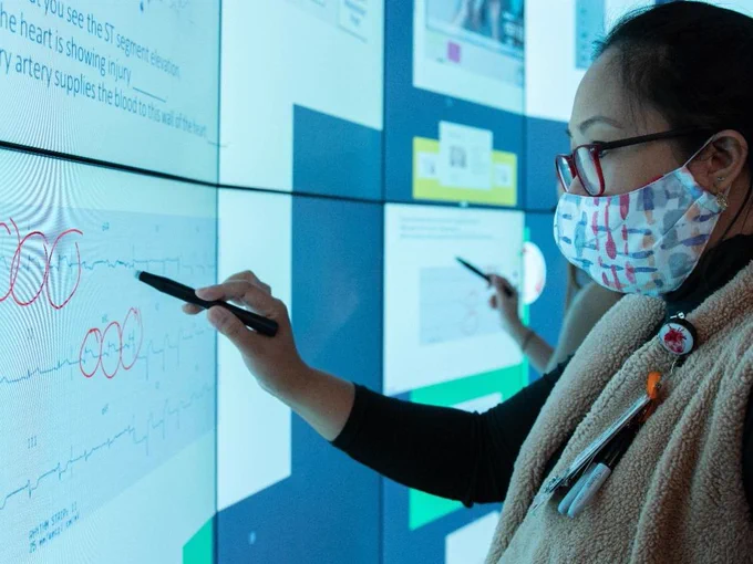 University of Nebraska Nursing student using the iEXCEL wall