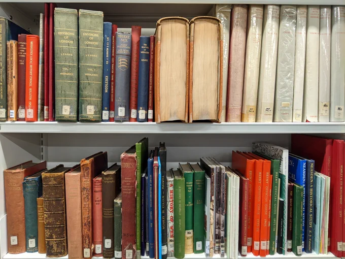Colour photograph of two bookshelves showing local history books about Brent and historic Middlesex.