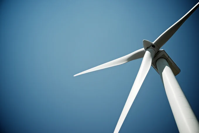 Photo of wind turbine. One application for Vanadium Redox Batteries is storing the energy generated by wind farms, expanding the capacity of this renewable energy source. US Vanadium is a Vanadium producer based in the United States, and a producer of high purity vanadium.