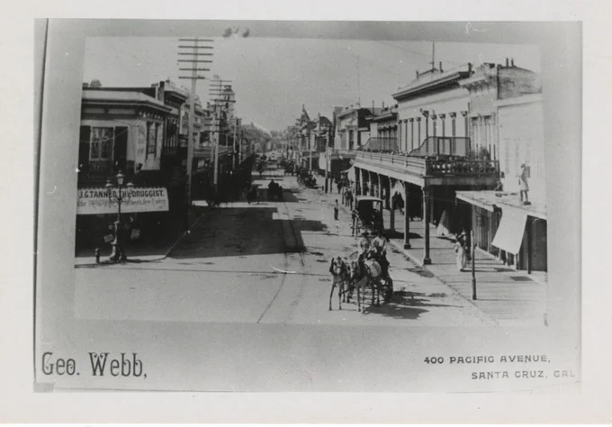 Arial view of Pacific Avenue. A horse drawn carriage is riding down the street.