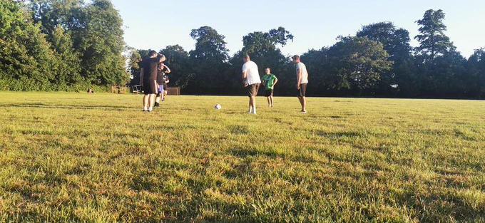 Men playing football and having fun whilst not touching each other 😂