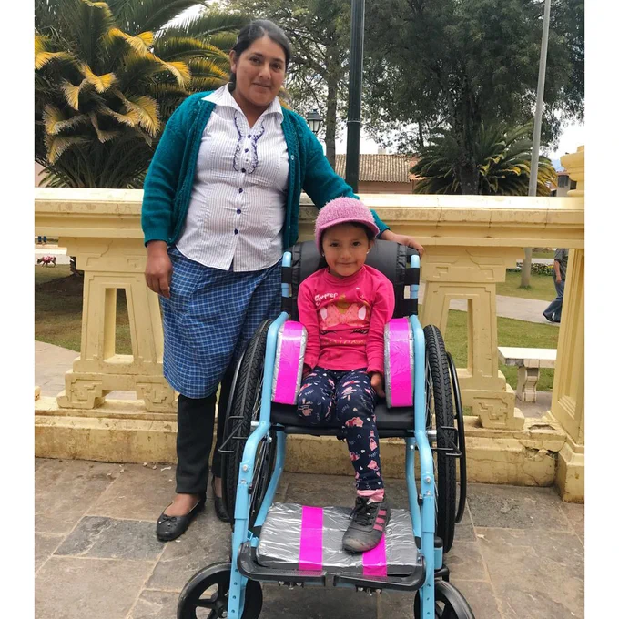 Mayuri after in her wheelchair next to her mother