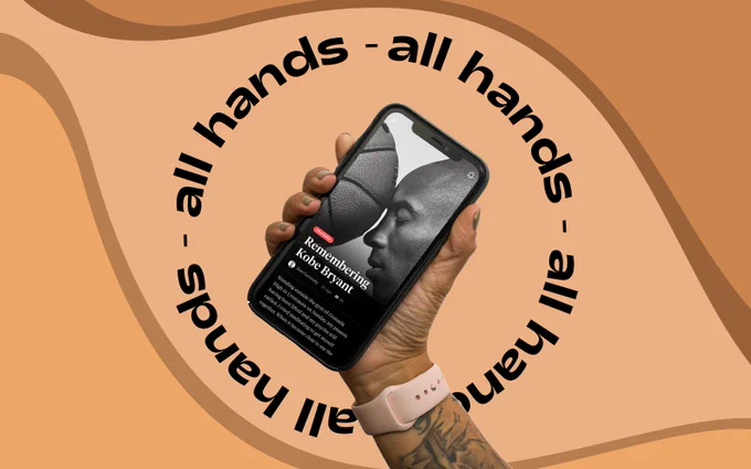 A hand holding an iPhone with a picture of Kobe Bryant and a basketball.