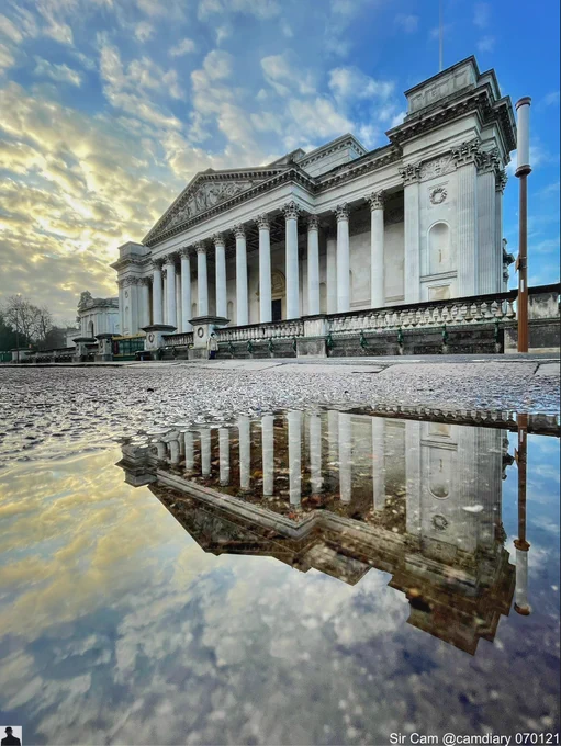 Fitzwilliam Museum reflected in a puddle. Cambridge 21 January 2021.