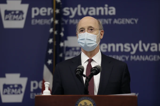 Governor Wolf speaking at PEMA while wearing a mask.