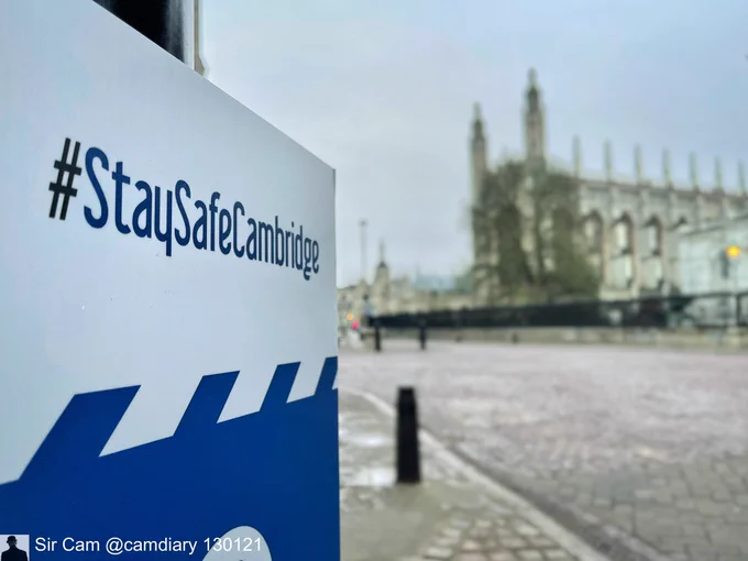 King’s College Chapel, Cambridge, 13 January 2021. View down King’s Parade with a Cambridge City Council sign reading #StaySafeCambridge in the foreground.