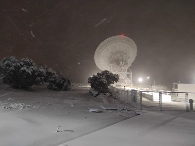 The Madrid Deep Space Telescope, with a white landscape covered in snow.