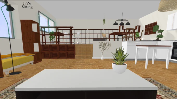 A view of an apartment seated at a coffee table.  To the right is a bit of a kitchen visible and directly in front there is a mezzanine raised 5 steps above ground level with a desk and dining table on it.