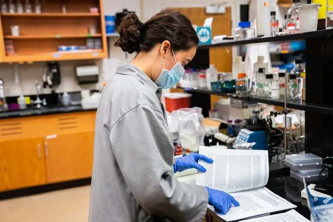 Michelle Landstrom, Surveillance and Monitoring Technician, prepares waste water samples that were collected with a GLS Sampler to be analyzed for the presence of COVID-19 around the Colgate University campus.