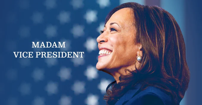A photo of Kamala Harris smiling in front of an American flag beside text that reads "Madam Vice President"