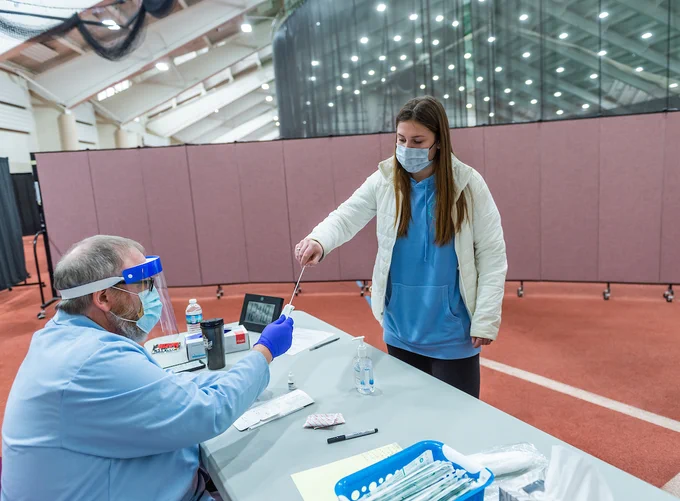 Students get COVID-19 testing while moving back on to campus for spring semester. 