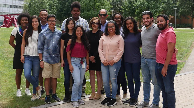 People smiling in a group outside