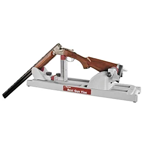 For cleaning break-open shotguns and rifles, or rifles that feature hinged design, remove the forend upper support from the forend base and secure the upper support directly to the extreme end of the base. This position allows the barrel to extend below the height of the bench. Install the grip support with the longer leg upright, relatively close to the forend support, which will bear the firearm near the hinge. Because the firearm has moved toward one end of the vise, the rear clamp support can be moved closer to the grip support to accommodate the different position of the butt stock.

https://www.lifedecoraddict.com/tipton-best-gun-vise-mna-811817.html