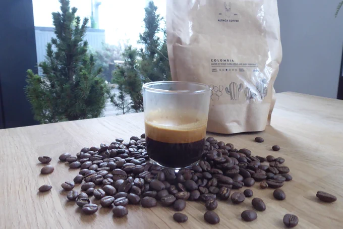 Espresso shot and coffee beans from Alpaca Coffee Roasters. Photo by Coffee Diff