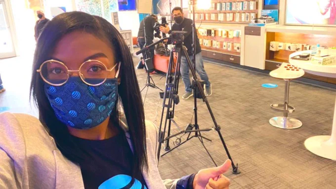 Jenne prepares to film for a shoot at her retail store.
