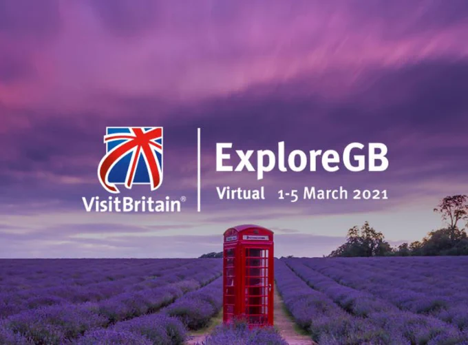 A red letterbox in a field of purple lavender, with ExploreGb and VB logos on top