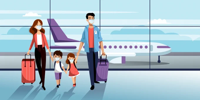 Family walking through an airport wearing masks