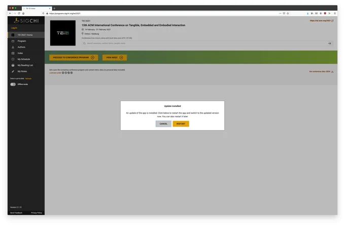 A screenshot of the ACM TEI online conference program with an alert asking to restart something.
