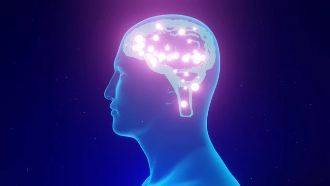 The same image, but his brain is now glowing brighter, and bright sparks are present.