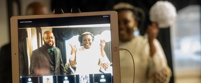 Miami Mergers Sergio Eddie ’13 and Janée Kelly-Eddie ’14  celebrating their wedding day and sharing a special moment with ones over Zoom. 