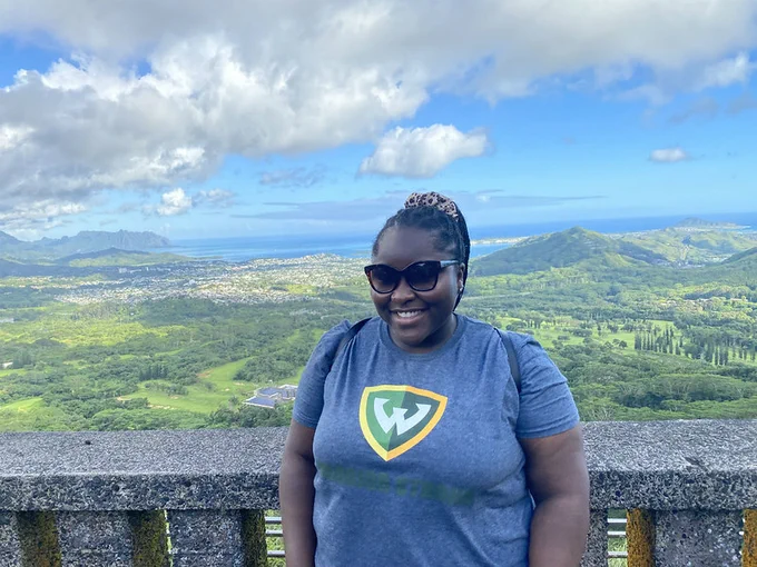 Woman smiling in front of mountains