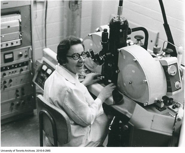 Black and white photo of Ursula Franklin working in a laboratory.  