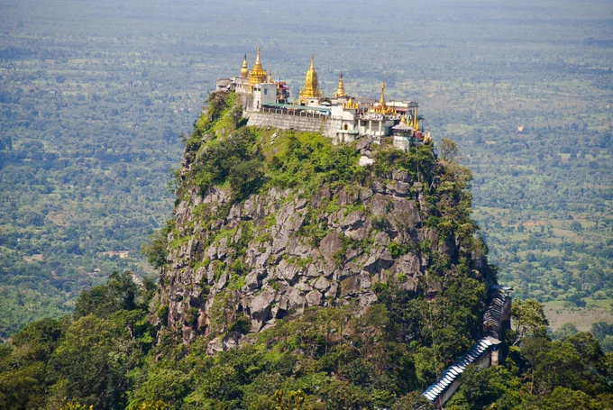 Mount Popa which is a very sizeable extinct volcano and which overlooks a vast expanse of much lower land.  Home to the Popa langur monkeys.
