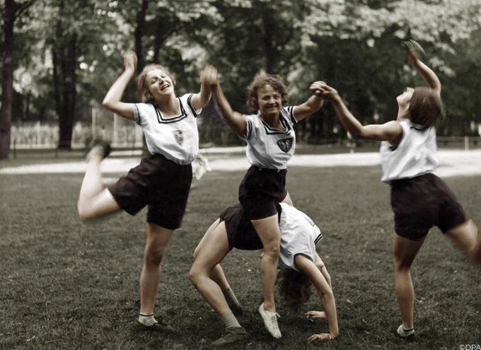 women in Germany doing exercise and gymnastics on grass