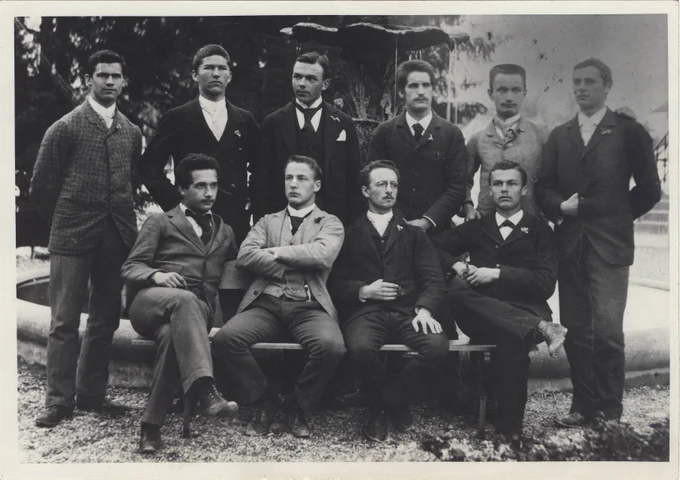 Einstein at University poses with 9 other students