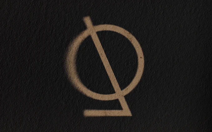 TripMapper logo made with gold spray paint on paper